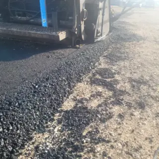 Closeup of asphalt being put down by Wright's Paving.
