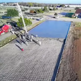 Aerial view of a drive constructed with Wright's Paving concrete work.