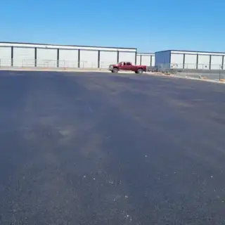 Commercial parking lot paved with asphalt.